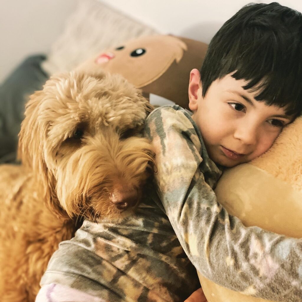 Dean's service dog Wally comforts him.